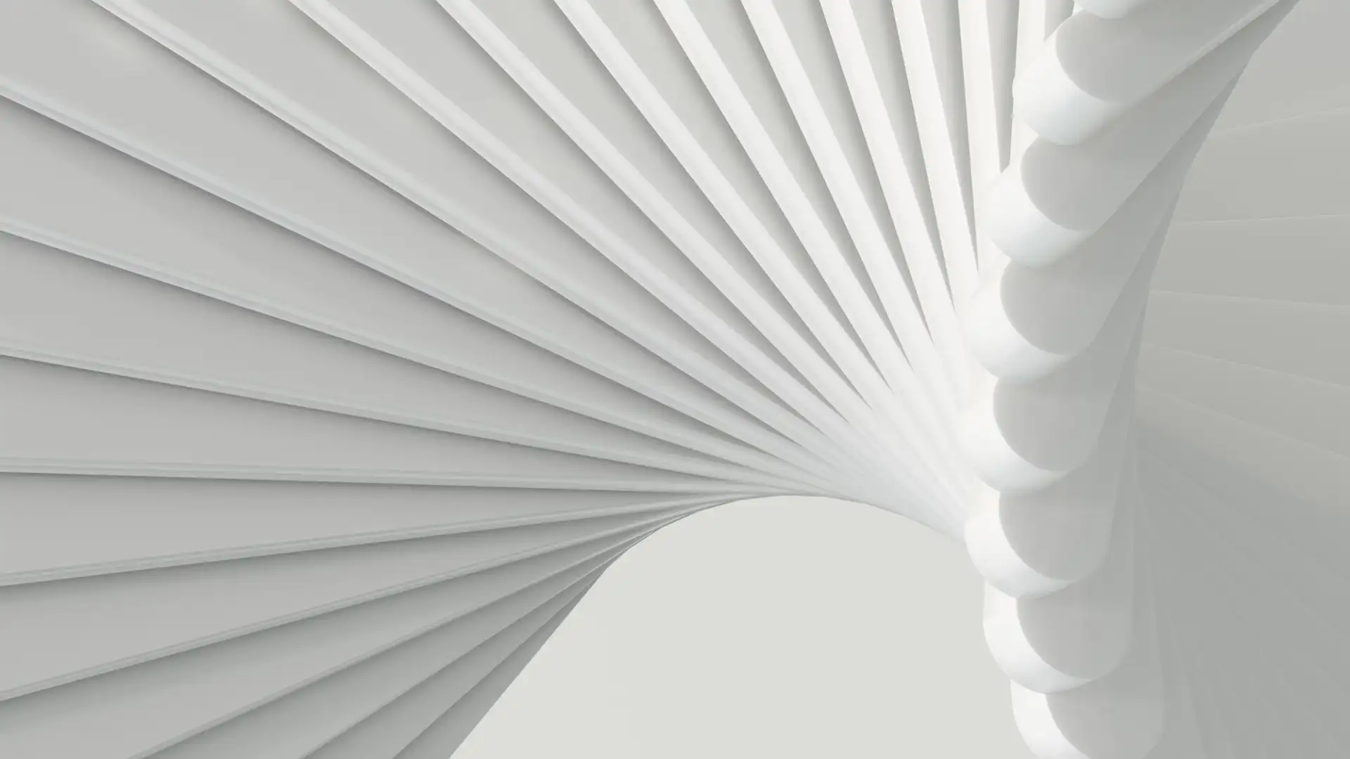 A pleated white surface curving into a funnel, its folds tightening toward the center