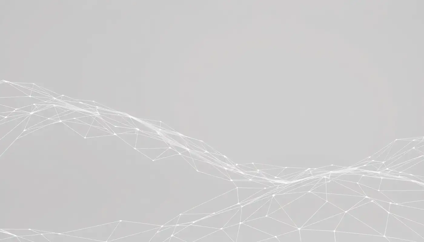 Fine pale filaments forming a loose web against soft grey