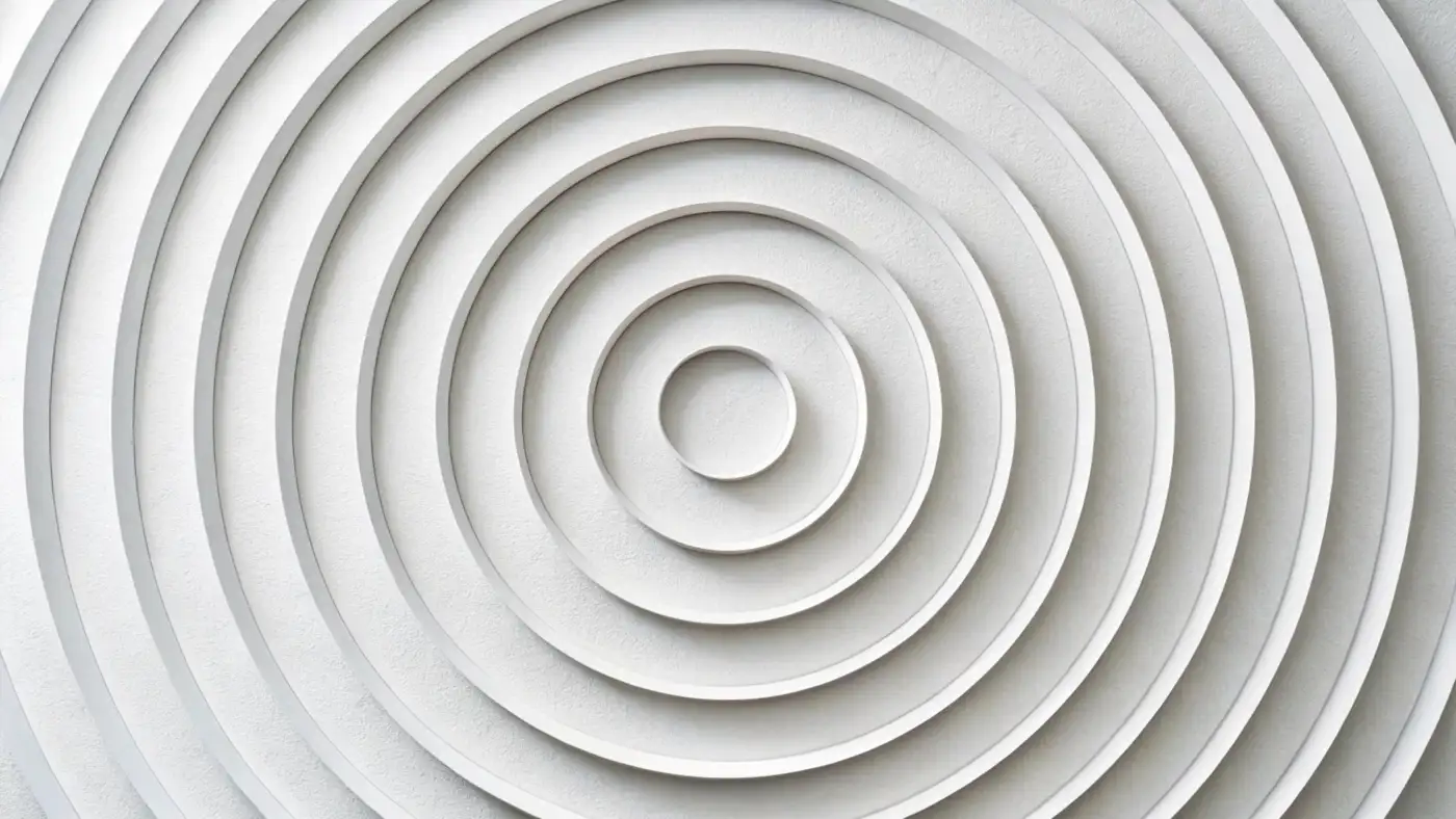 Concentric raised rings in white, stepping down toward a central point