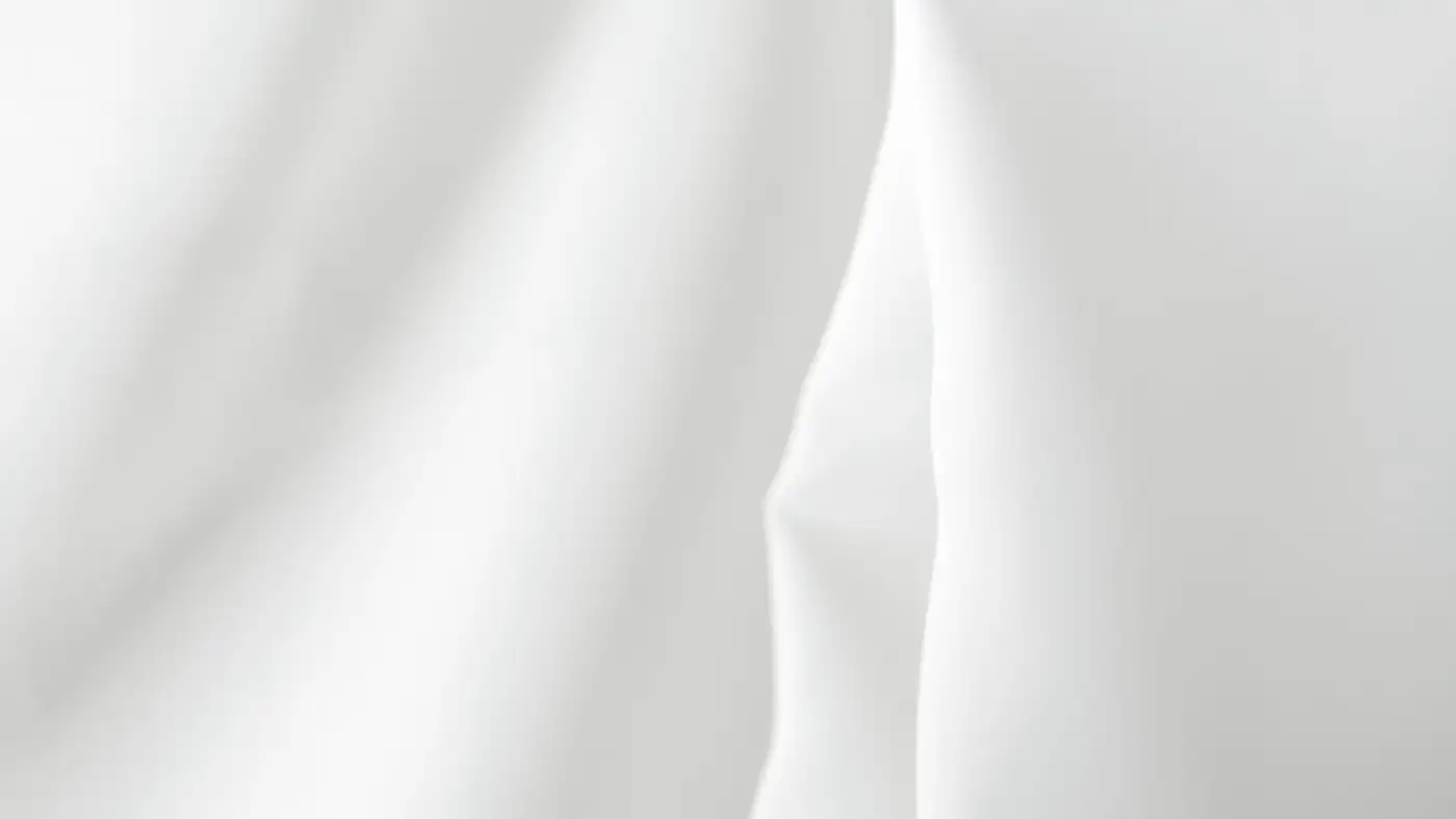 Soft white fabric falling in loose folds