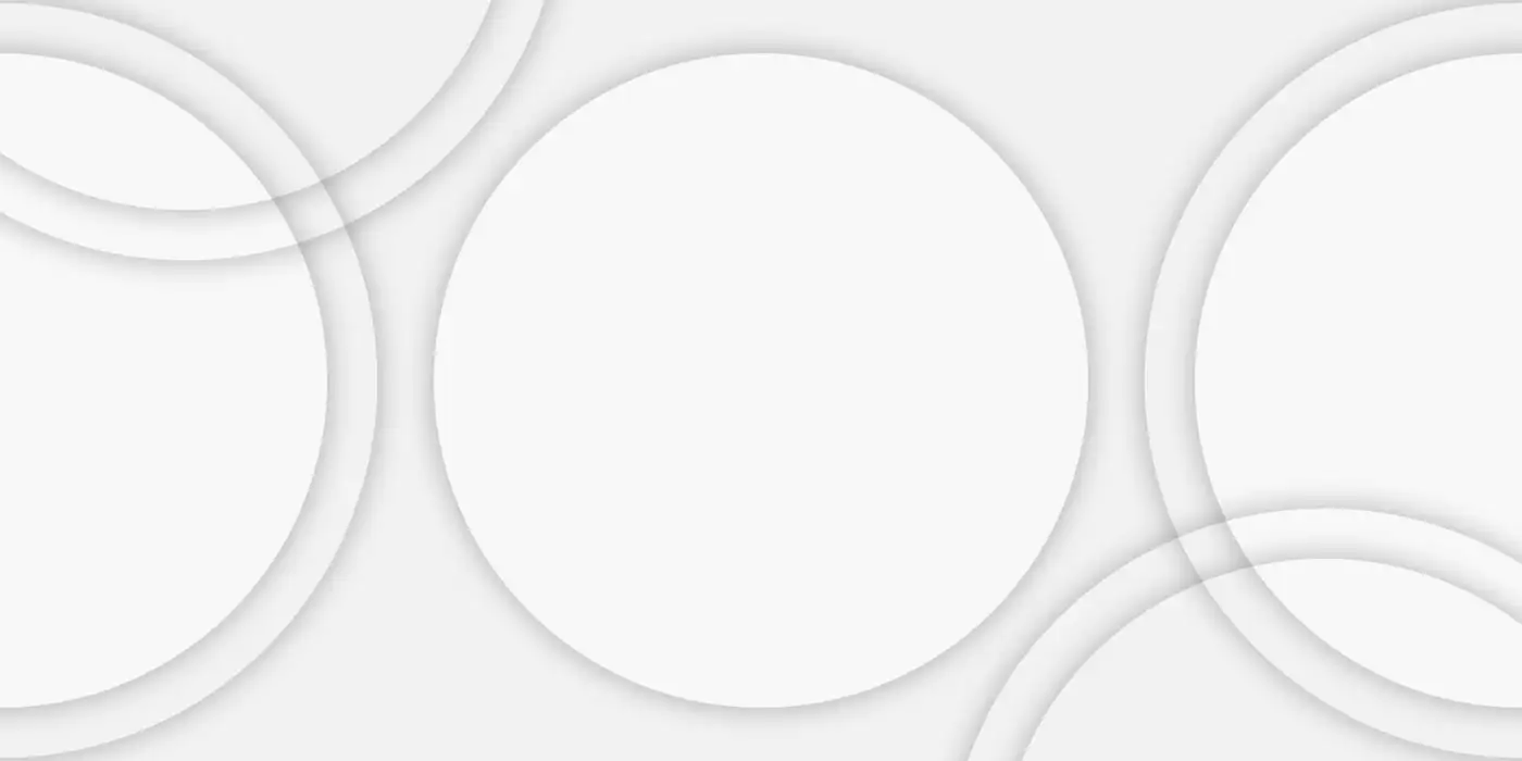 Large overlapping circles embossed on an off-white surface