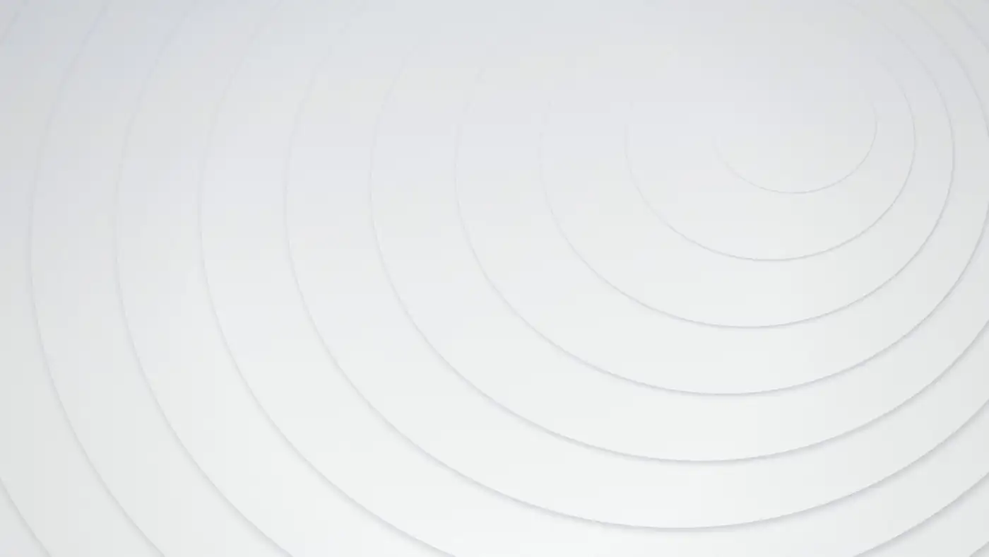 Faint concentric rings pressed into a plain white surface