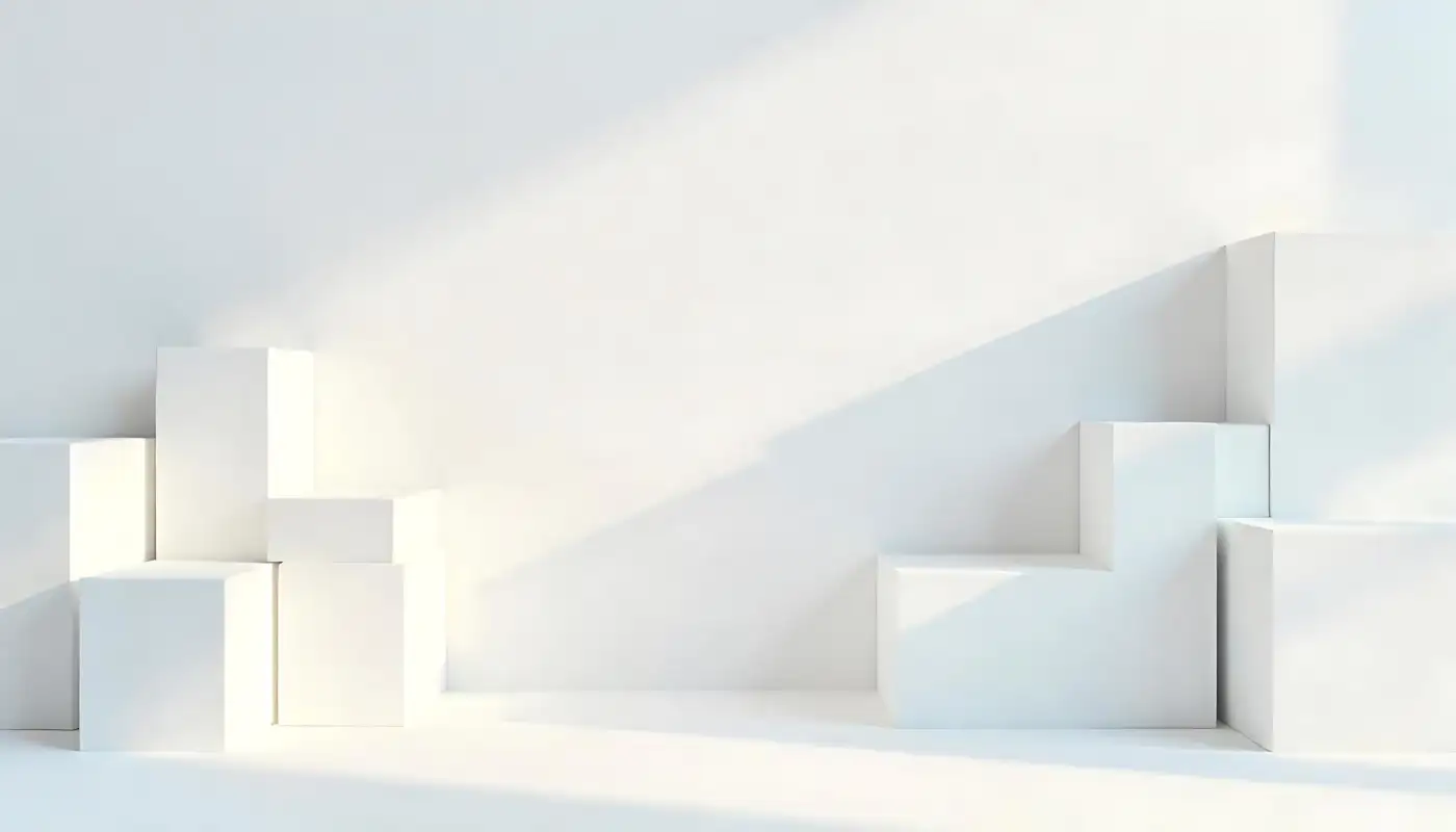 Simple white blocks arranged on a pale floor, lit from one side